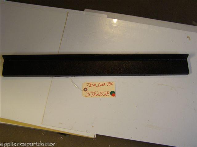 AMANA STOVE 31782102B  Trim, Door Top  SCRATCHES used PART